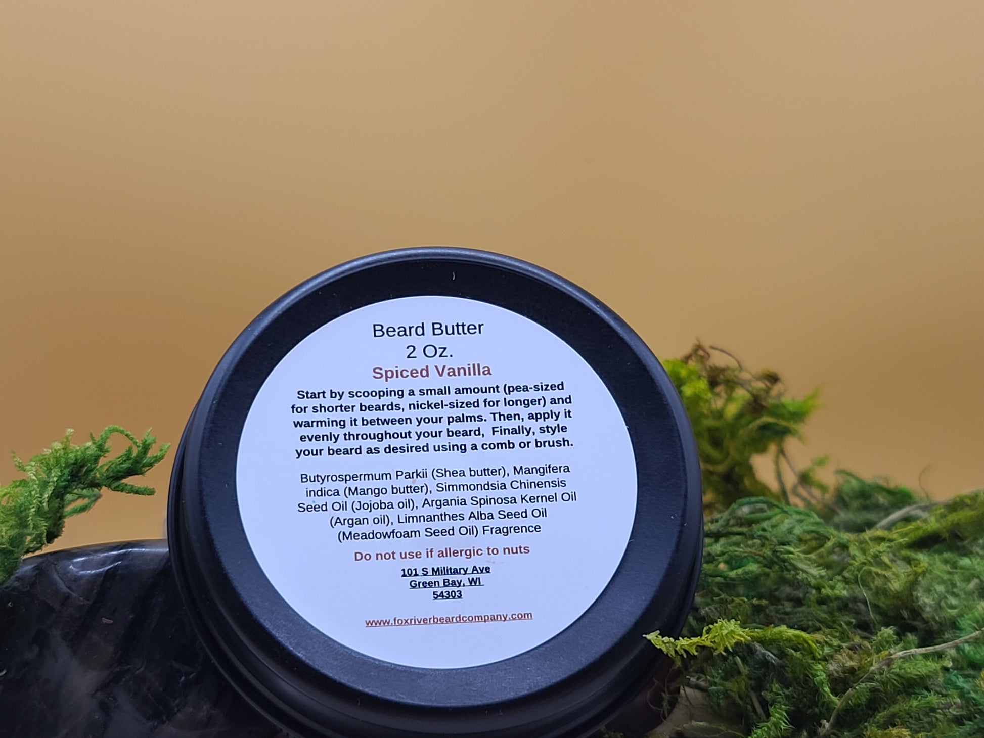 Beard butter container with label on a natural background