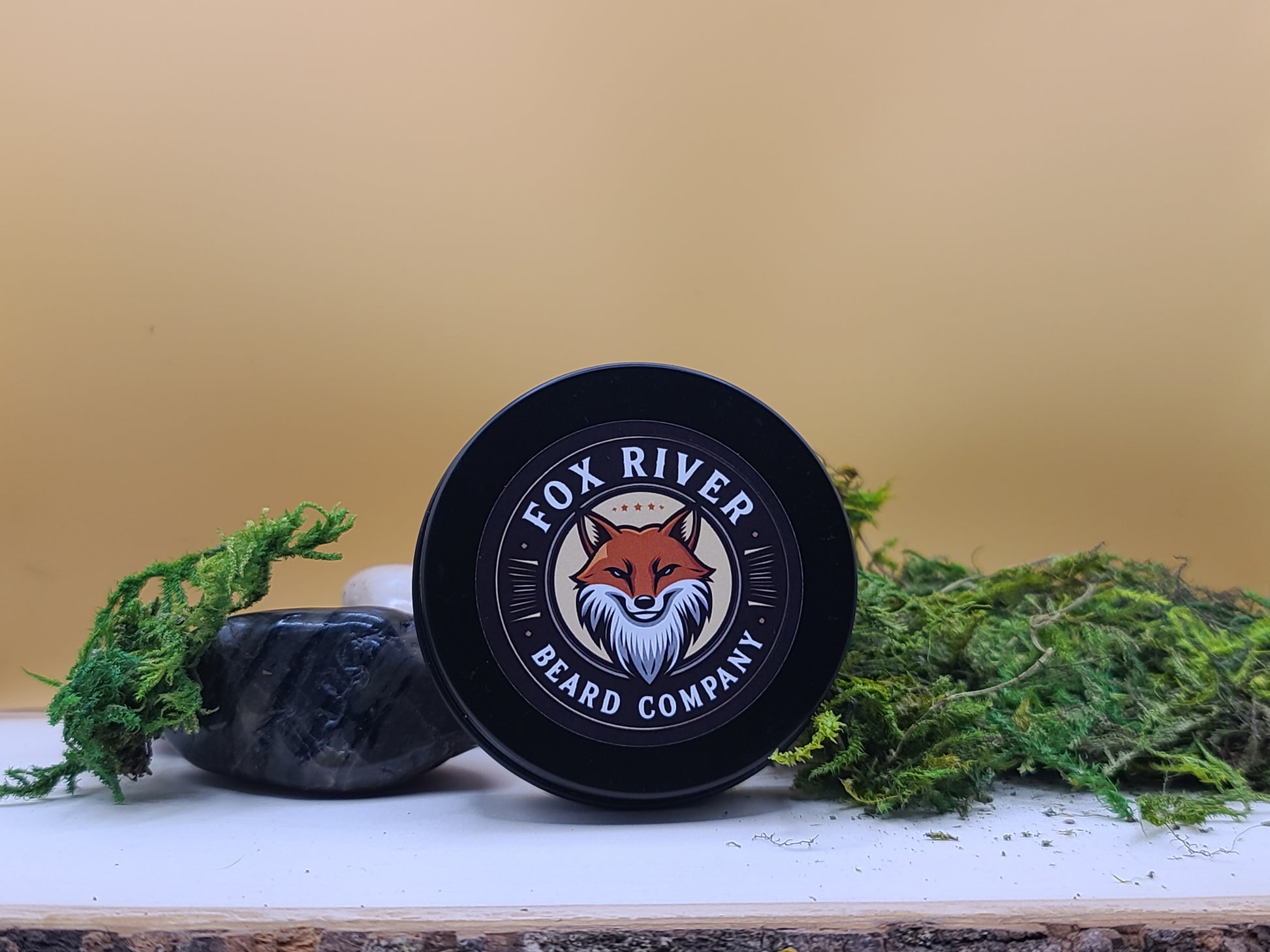 Fox River Beard Company product on a wooden surface with greenery