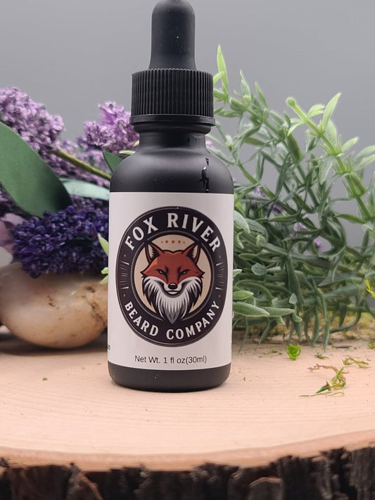 Bottle of Fox River Beard Company product on a wooden surface with plants in the background