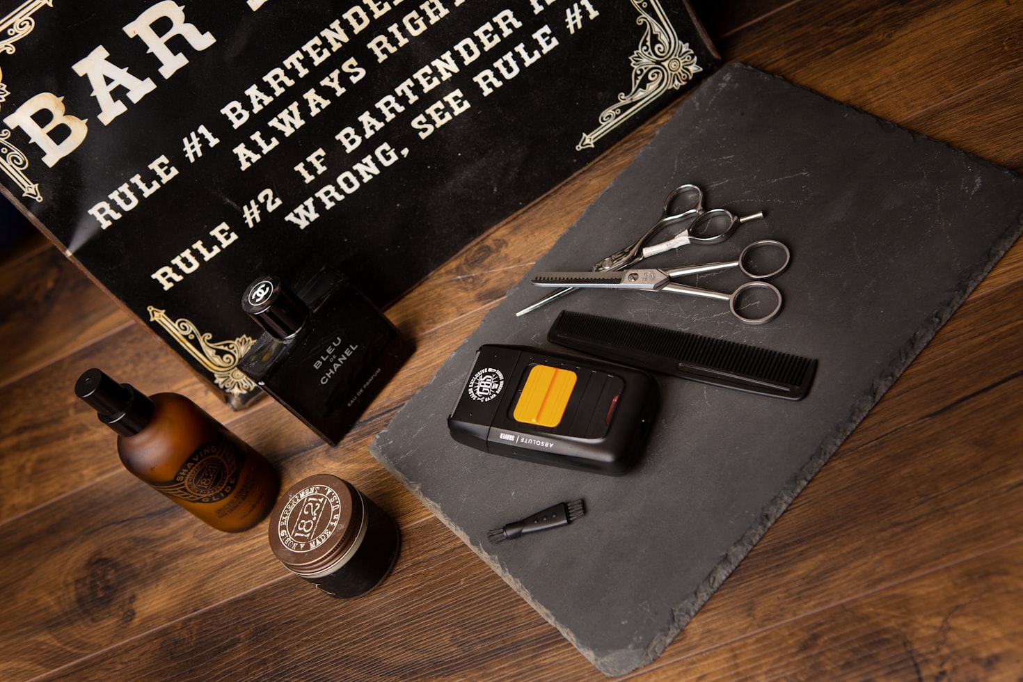 Multiple beard care products laying on a wooden table